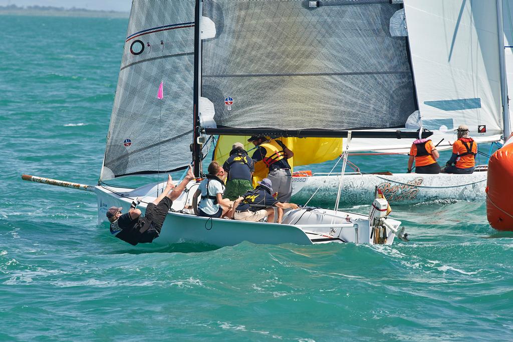 Mango Tango's bowman Mike Iversen goes over the side in today's Race 1 of the SeaLink Magnetic Island Race Week. The crew kept the kite full and the visiting German crew loved the action.  © John De Rooy